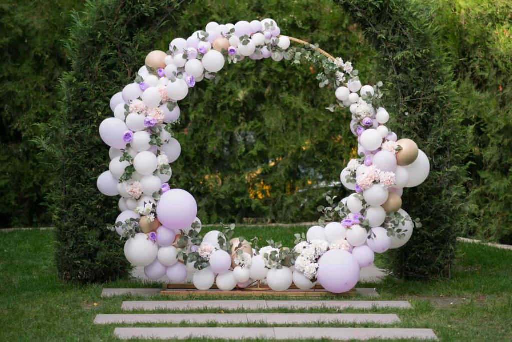 Wedding Balloons Arch Setup with flowers outside