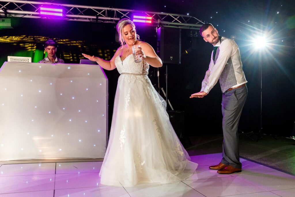 Wedding Couple having fun on the dancefloor at their wedding day in Amersham, Buckinghamshire. Eventize events wedding dj solutions